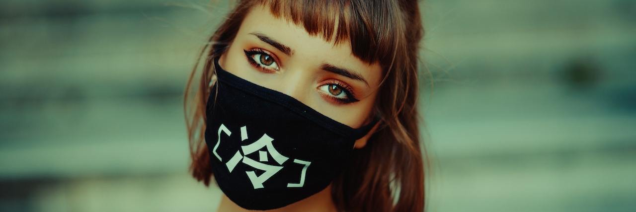 COVID-19 Restrictions May Trigger Trauma Survivors A woman wearing a mask