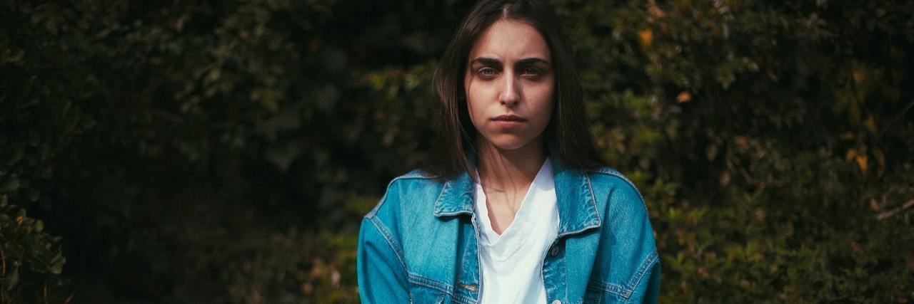 Bipolar Disorder: Developing PTSD After Mania A woman sitting