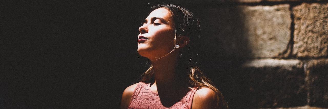 Patterns of a Troubled Mind: An Essay About Mental Health A woman standing in shadow