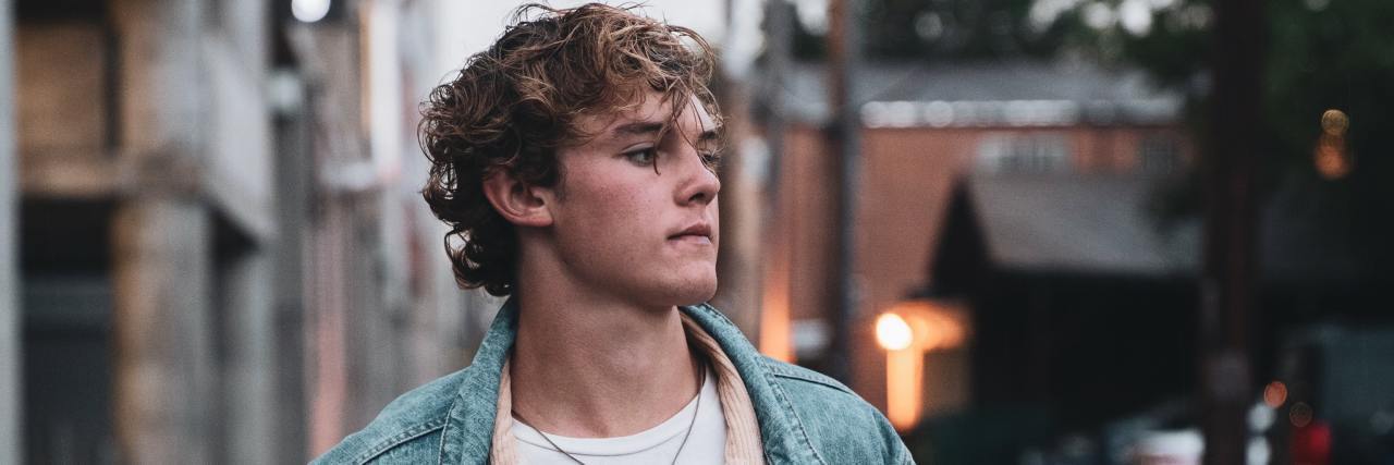 The Two Sides of My Mental Health A man standing outside