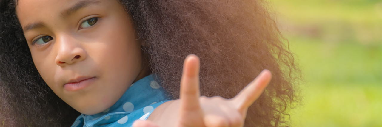My Deaf Daughter Doesn't Need to Be 'Fixed' Lucy, young African American girl signing.
