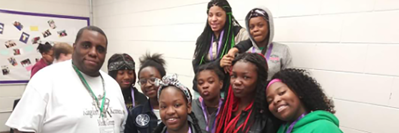 How Marcus Boyd Is Using His Autism Diagnosis to Help Others Marcus Boyd with youth he mentors.