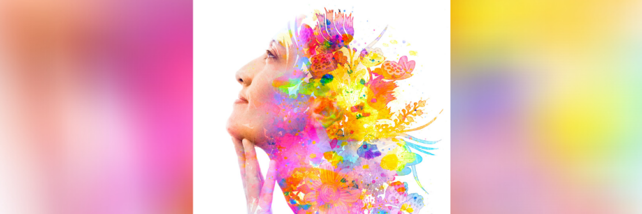 Paintography double exposure image of woman's profile combined with hand drawn colorful flowers and brushstrokes