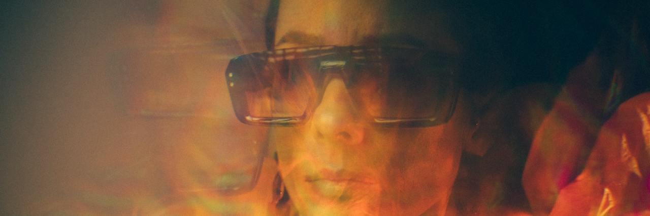 The Many Emotions of a Flashback as a Survivor of Sexual Abuse Hazy photo of woman wearing sunglasses