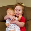 Ivy with her doll that has Down syndrome.