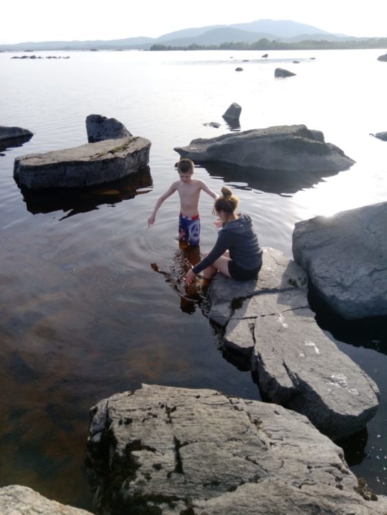 Freya and her brother playing in water.