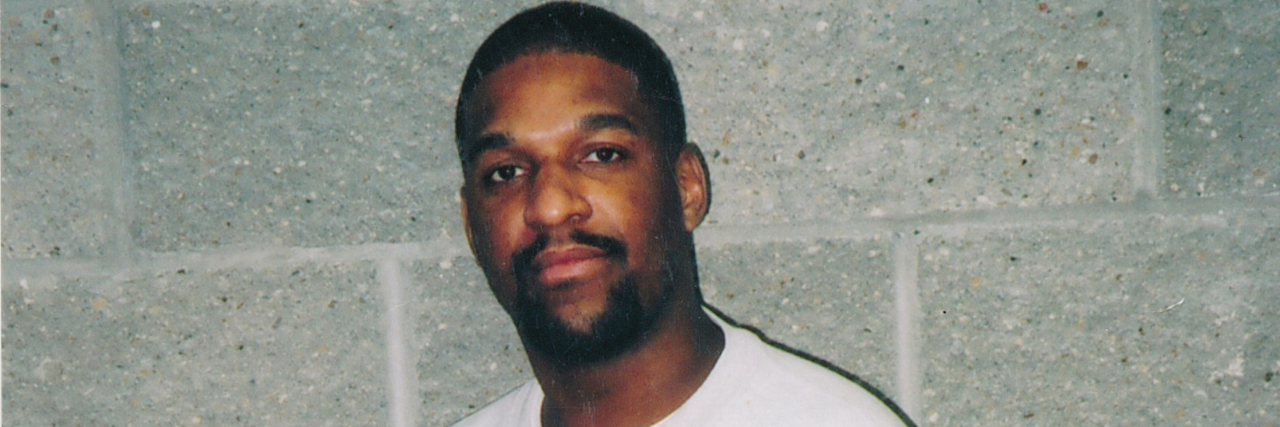 Disability Advocates Ask Trump to Halt Corey Johnson's Execution Corey Johnson, a Black man with facial hair wearing a white sweatshirt