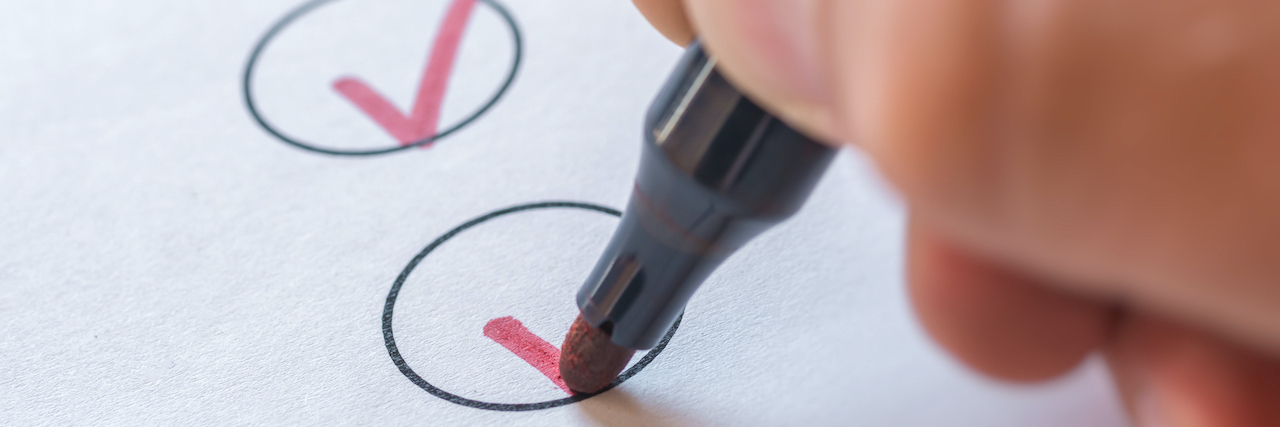 Setting Small Goals With Depression and Anxiety A woman checking off a list