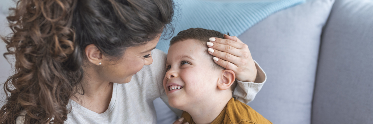 To Parents Whose Child Was Just Diagnosed With Muscular Dystrophy Mother and toddler son on sofa.