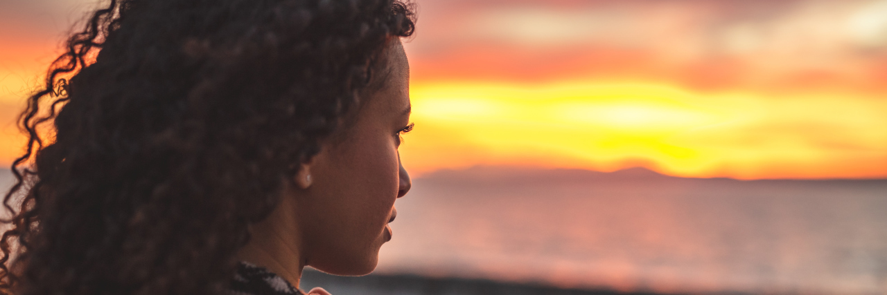 How Life Changed After My Bipolar Disorder II Diagnosis an african american woman gazing into the sunset