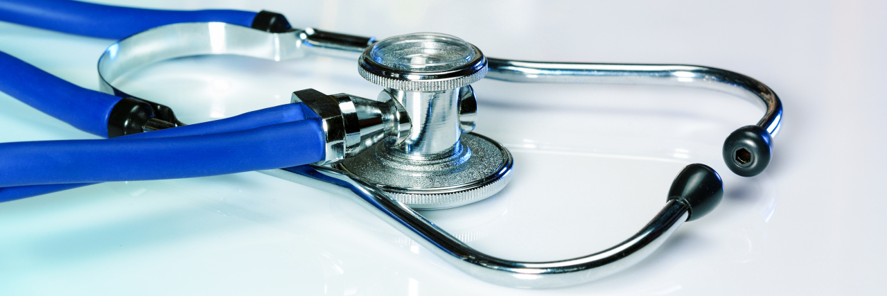 Dear Democratic Leaders: Please Prioritize Affordable Healthcare Stethoscope on desk.