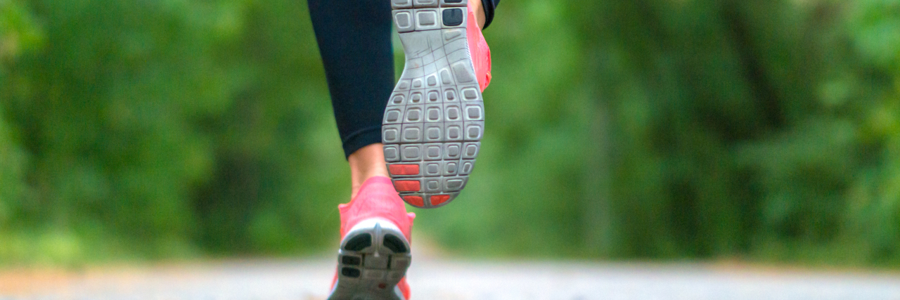 Redefining Strength in My Life With Chronic Migraine Woman running outdoors.