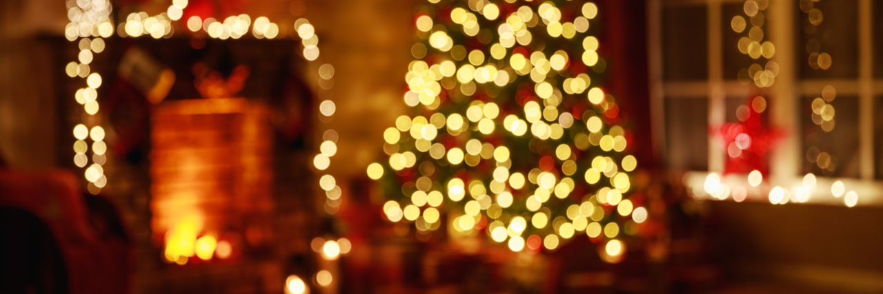 What Christmas 2020 Was Like for Me as a Blind Person Blurry room interior decorated for Christmas with tree and fireplace.