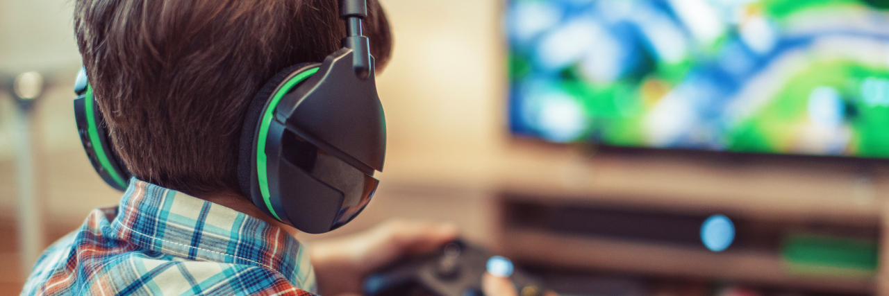 The Surprising Benefits of Gaming for My Son on the Autism Spectrum Teen playing MMO video game.