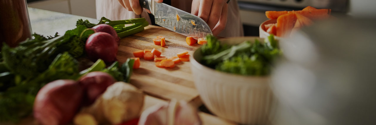 Why the CEO of Whole Food's Statement about Health Care is Ableist Someone preparing fruits and vegetables