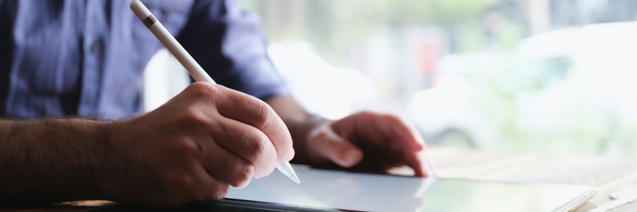 Considerations for Signing a 'Do Not Resuscitate' DNR Order Man writing on a tablet