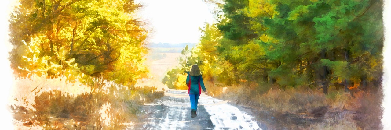 When the Path to Healing Doesn't Look How You Think It'll Look woman walking along a road.