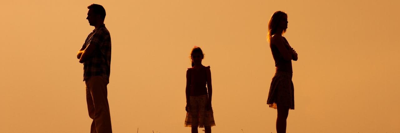 Rockstar Tips on How to Effectively Co-Parent silhouette of a man and woman standing across from each other and a little girl in the middle