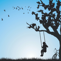 Silhouette of child on a swing on a tree, with birds flying above and bike nearby