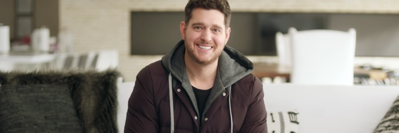 Why I Don't Believe #BellLetsTalk Day Is Enough for Mental Health Care screenshot of Michael Buble from the Bell Let's Talk (#BellLetsTalk) campaign video for 2021, smiling for the camera