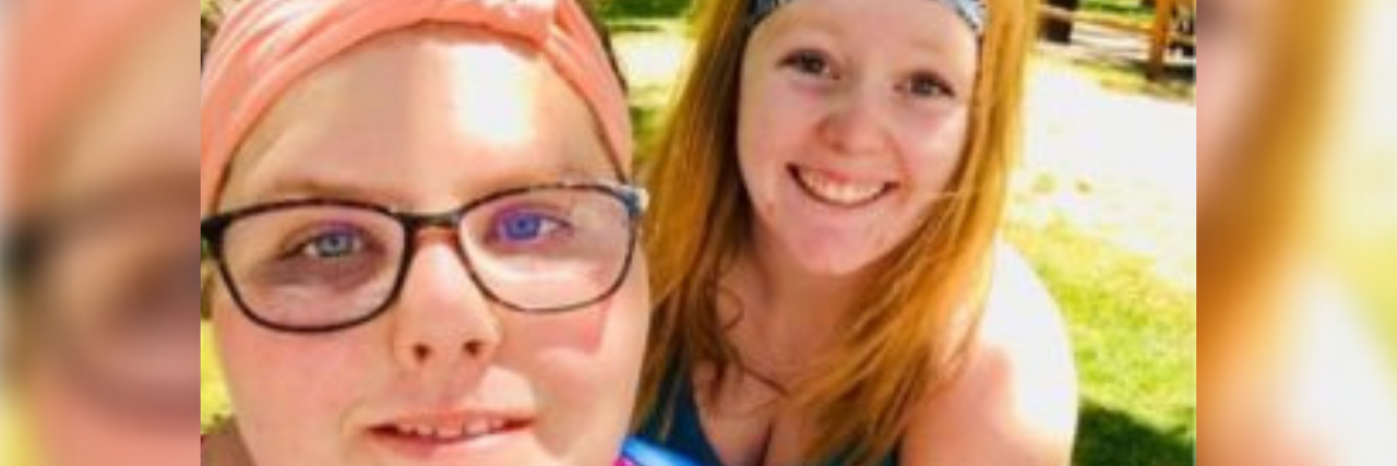 How ‘Five Feet Apart’ Reveals What Friendship Looks Like With Chronic Illness Photo of author and her best friend; two young adult white females taking a selfie after working out
