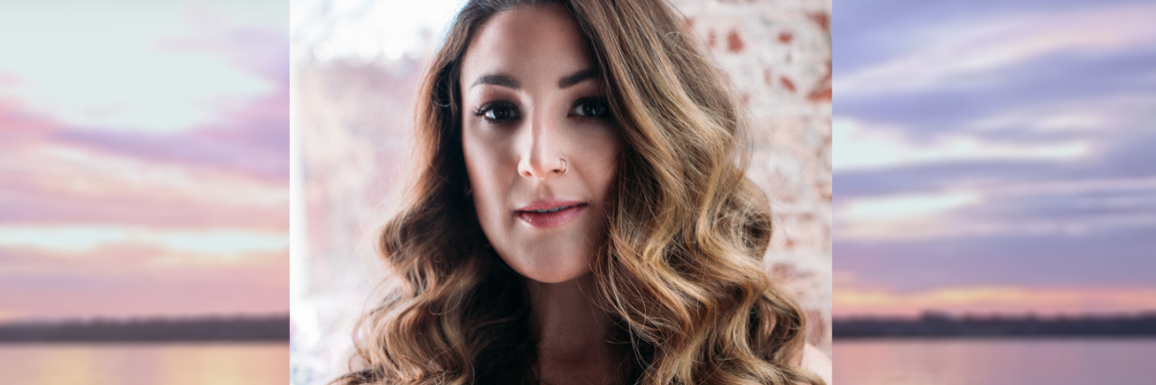 Olivia Castriota: Why I Wrote the Song 'Fixed' A headshot of the author, who has long curly brown hair and is wearing a red dress.