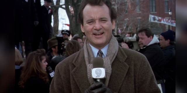 How 'Groundhog Day' Parallels a Journey With Addiction Bill Murray talking into a microphone in "Groundhogs Day"