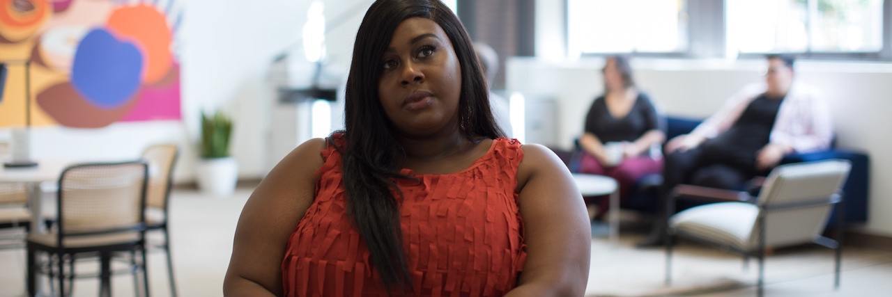 How to Counteract the Pressure to Lose Weight in a New Year A woman sitting at her laptop