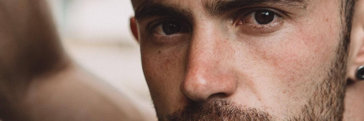 The Signs of Shame I Experience as an Autistic Person A man looking out
