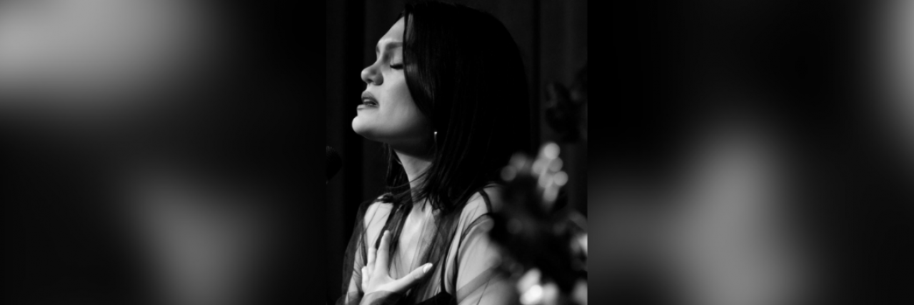 Black and white photo of Jessie J performing