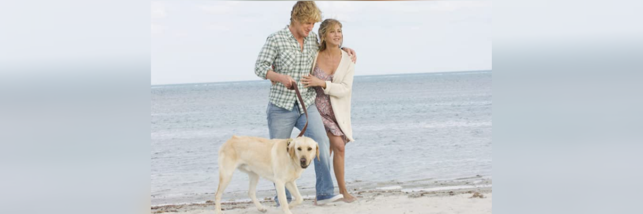 How 'Marley & Me' Nailed Its Depiction of Postpartum Depression Photo of Owen Wilson and Jennifer Anniston with dog on a beach