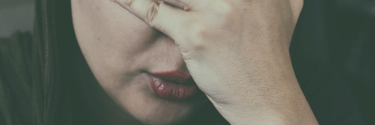 A Day in the Life of Someone With Severe Anxiety A woman with her hands on her face