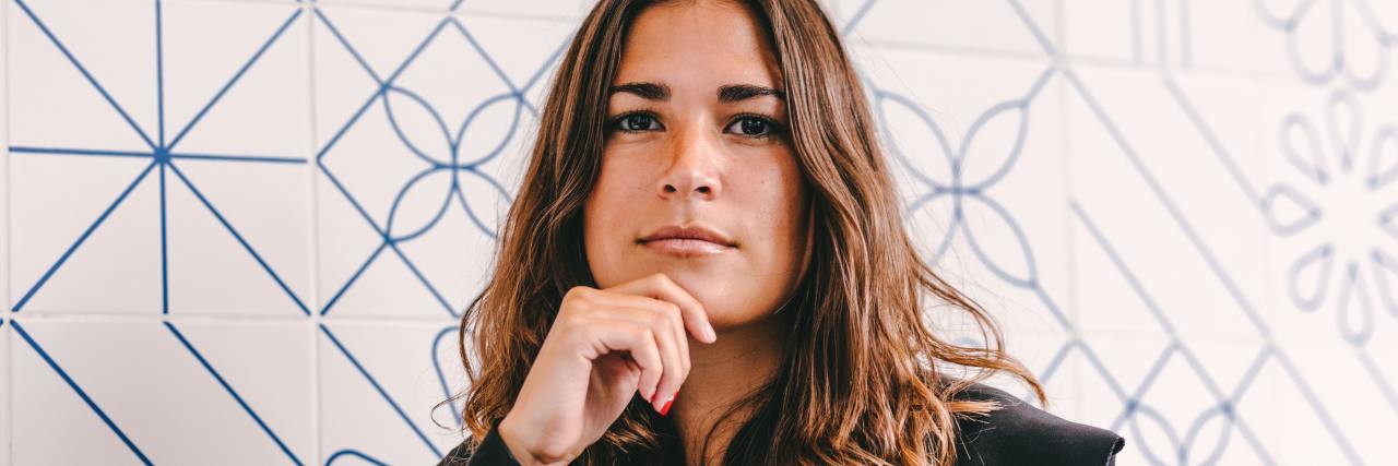 We Need to Talk About 'Diagnostic Limbo' A woman looking serious