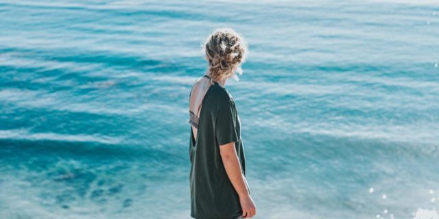 6 Lessons Living With OCD Has Taught Me photo of woman looking out to blue sea on bright sunny day