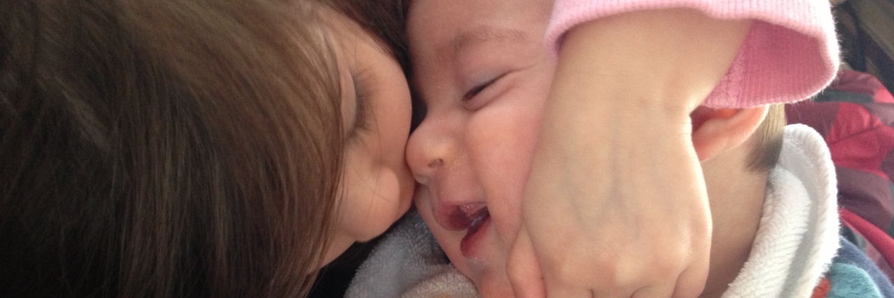 What My Children Taught Me About Acceptance and Inclusion Jaclyn's daughter embracing her son.