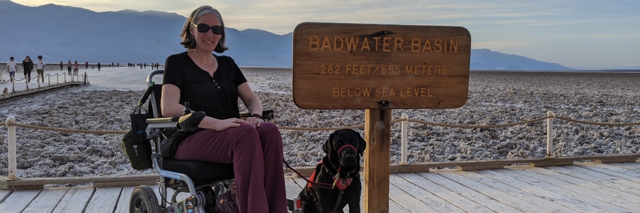 How My NEADS Service Dog Changed My Life Naomi at the beach with her service dog, Charlie.