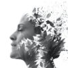 Double Exposure portrait of woman's profile combined with hand drawn watercolor painting of leaves and ink splash, black and white