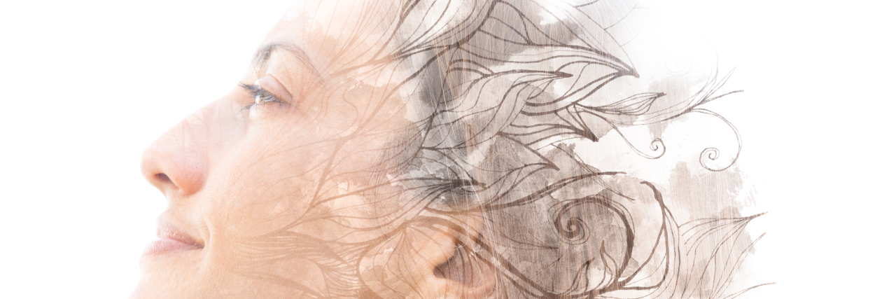 Double exposure. Paintography of a woman with flowers.