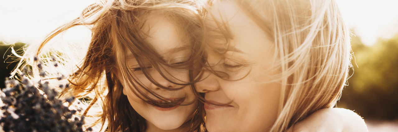 I Realized I Have Autism After My Daughters Were Diagnosed Girl embracing her mother.
