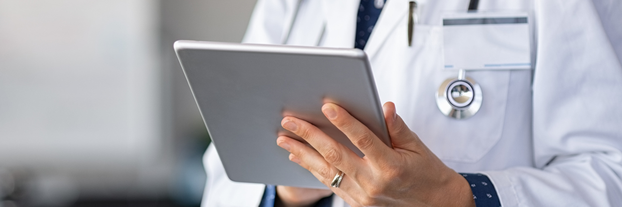 6 Reasons a Misdiagnosis Makes Understanding Your Body Confusing Close up of woman doctor hands using digital tablet at clinic.