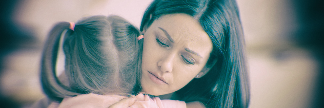 Learning to Be Brave as the Parent of a Child With Leukodystrophy Mother hugging daughter.
