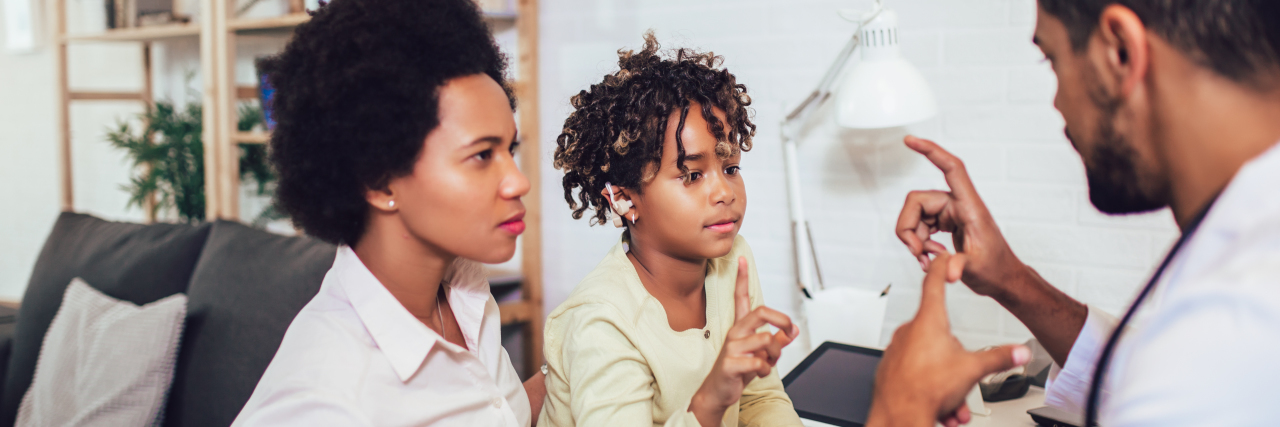 5 Early Interventions You Can Implement for Your Child Now Girl practicing sign language