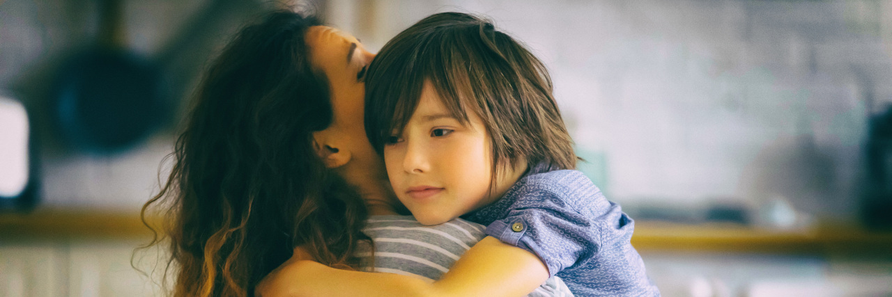 Perspectives on Meltdowns From an Autistic Mom and Son Mother and son hugging.