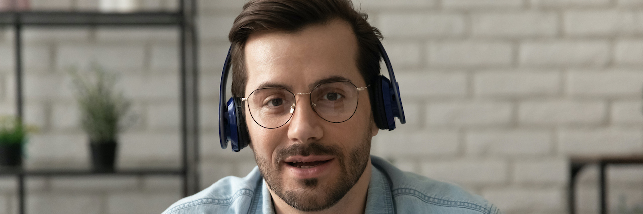 Man wearing headphones on video call