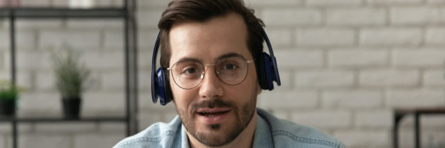 Man wearing headphones on video call