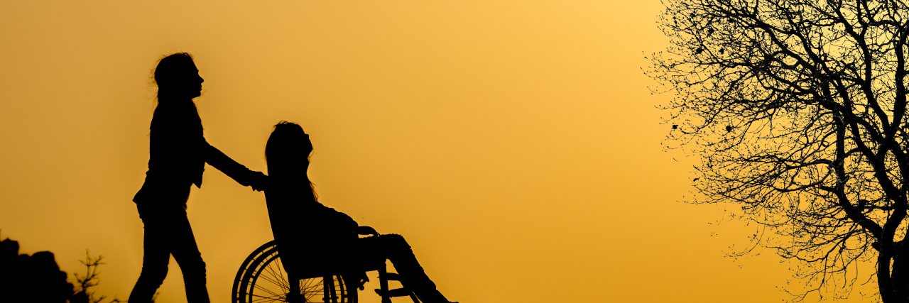 Addressing Parent Guilt When a Child Has a Disability Mother pushing daughter in wheelchair.