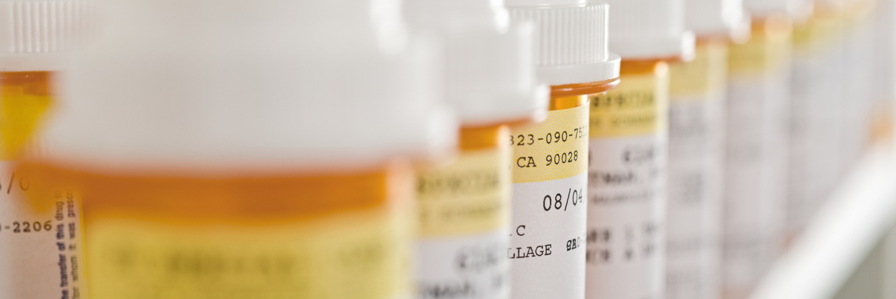 Report Finds Anti-Baldness Drug Propecia May Lead to Increased Suicide Bottles of pills arranged in shelf at a drugstore