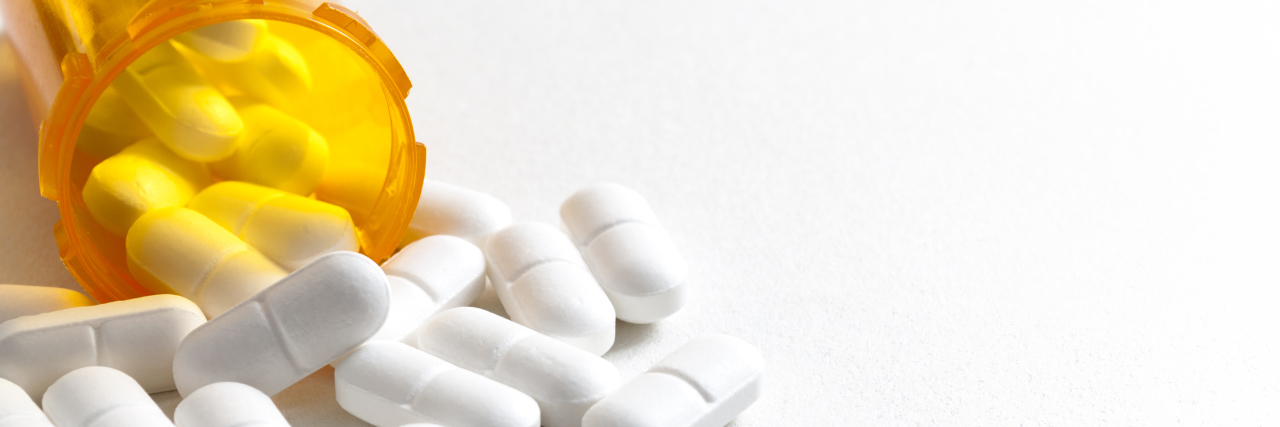 Catastrophic Withdrawal to Launching a Tardive Dyskinesia Nonprofit pills sitting next to medicine bottle