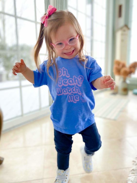 Ivy smiling and wearing a blue shirt.