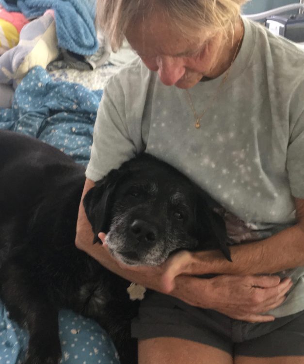 Ellen holds elderly Maggie.